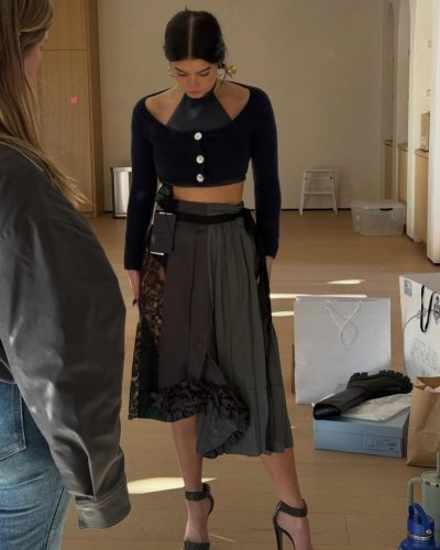 Charli D'Amelio in black hoodie and relaxed gray sweatpants