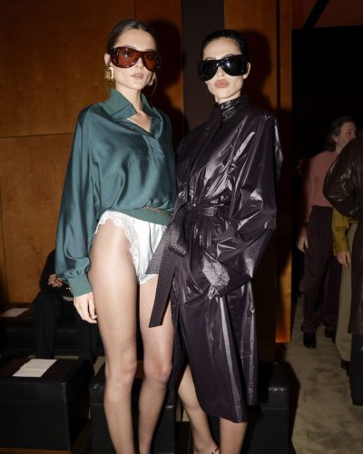 Charlotte Lawrence relaxed green blouse with billowy sleeves and lace shorts.