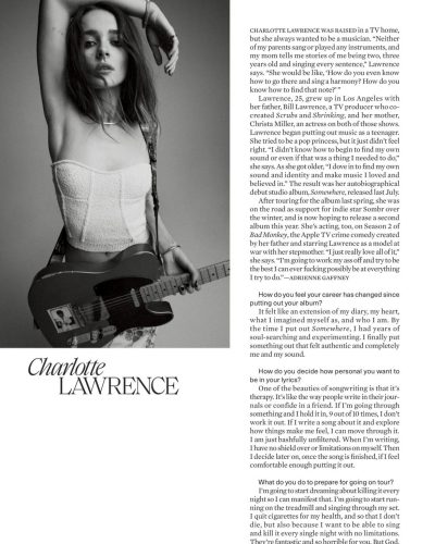 Charlotte Lawrence in sleek black blazer with fitted black pants.