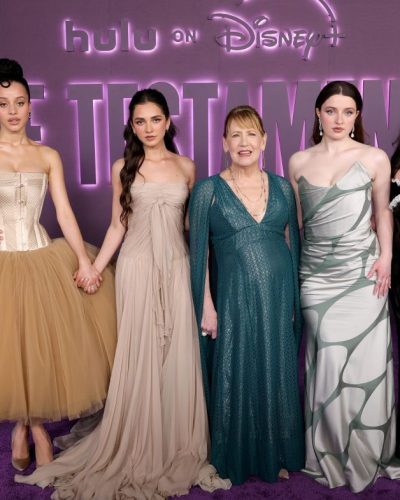 Chase Infiniti in soft beige dress with flowing silhouette.