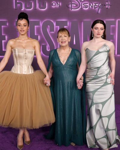 Chase Infiniti in flowing layers of beige tulle gown.