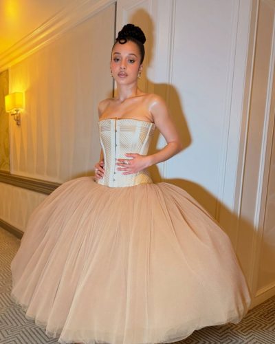 Chase Infiniti wearing a gown that sparks modern fashion discussions.