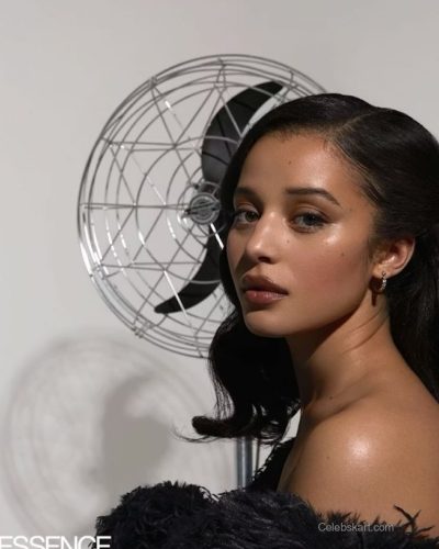 Chase Infiniti wearing bold blue fur coat and chic accessories.