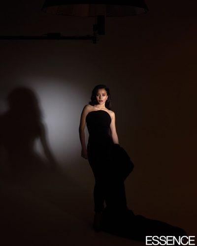 Chase Infiniti wearing rich blue fur coat and sophisticated accessories.