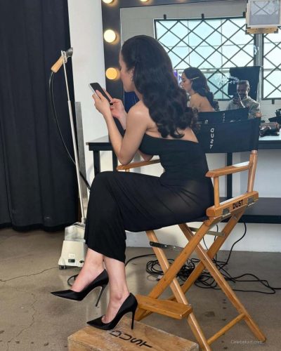 Chase Infiniti in luxurious blue fur coat with complementary hues.