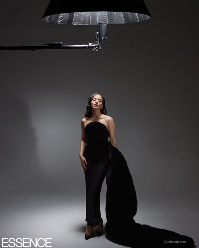 Chase Infiniti styled in striking blue fur coat and subtle rings.