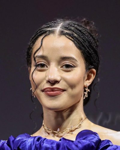 Chase Infiniti in dramatic puff sleeve deep blue dress.