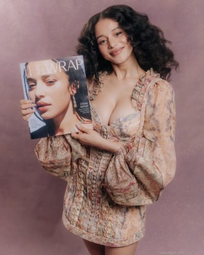 Chase Infiniti in chic dress with a daring neckline.