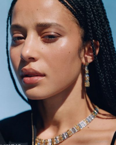 Chase Infiniti in plunging neckline gown with shimmering embellishments.