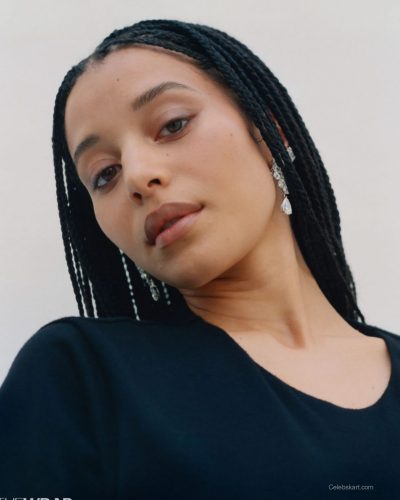 Chase Infiniti in vibrant dress featuring intricate embroidery.