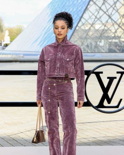 Chase Infinity with chic purple velvet jacket and stylish handbag.