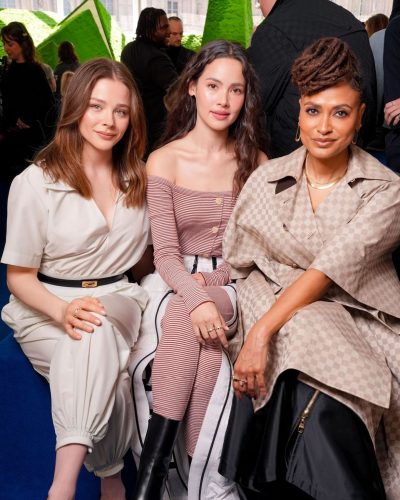 Chloe Moretz wearing sophisticated white jumpsuit for fashion week.