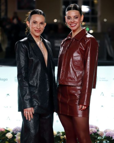 Clara Alvarado in tailored burgundy leather jacket with stitching