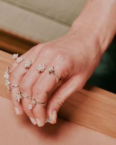 Claudia Jessie in refined gray top and stylish black trousers.