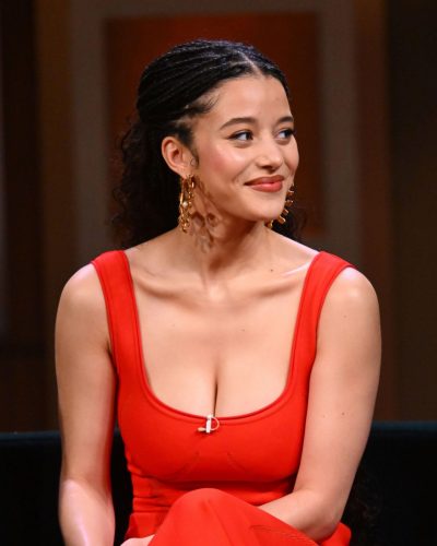 Chase Infiniti eye-catching red dress with chic gold accessories