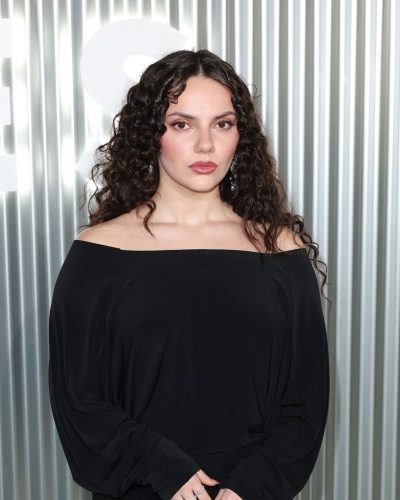 Dafne Keen wearing chic black dress with youthful flair