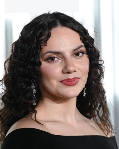 Dafne Keen wearing black off-the-shoulder dress with graceful silhouette