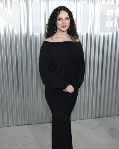 Dafne Keen in black gown complemented by cascading hair
