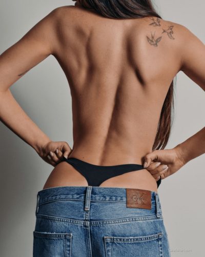 Dakota Johnson in black swimwear with a contemporary flair