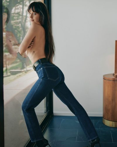 Dakota Johnson wearing black swimwear with a relaxed vibe