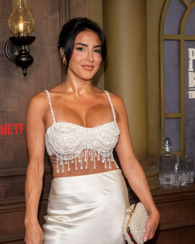 Danielle Iodice in a sleek satin skirt flowing to the floor