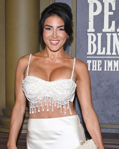 Danielle Iodice in pearl beaded crop top and satin skirt