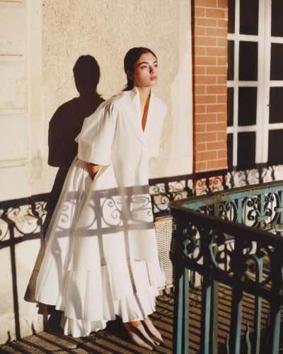 Deva Cassel in floral dress with soft colors and intricate details