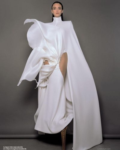 Deva Cassel in a white gown with refined cuts and playful elements.