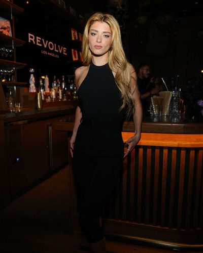 Dixie D’Amelio black jumpsuit featuring plunging armholes and tailored fit