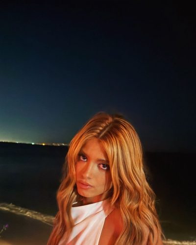 Dixie D'Amelio black jumpsuit with high neckline and open back