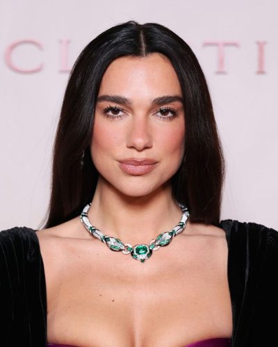 Dua Lipa elegant black velvet dress paired with black heels