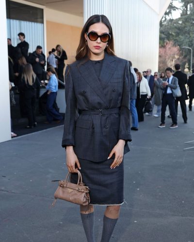 Eileen Gu with chic handbag complementing her tailored look.