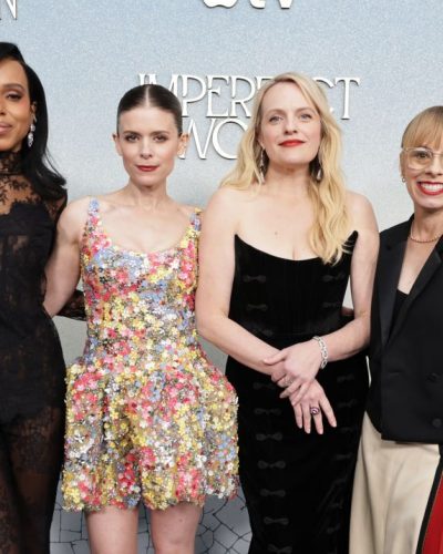 Elisabeth Moss wearing a black gown with eye-catching button design