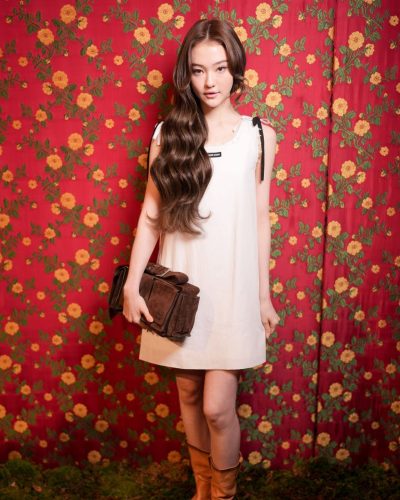 Ella Gross contemporary white dress with minimal accessories.