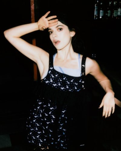 Ella Rubin in a vibrant green lace dress