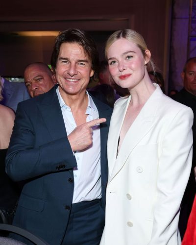 Elle Fanning in stylish white suit and black top