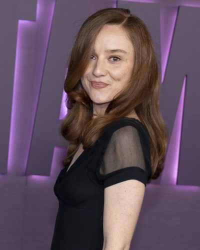 Ellen Olivia styled in black gown with delicate sheer details.