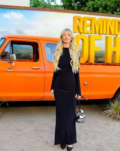 Emily Dobson black fitted dress with graceful silhouette