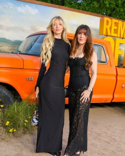 Emily Dobson black dress featuring a high neckline