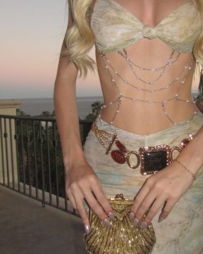 Emily Dobson in a chic halter dress featuring delicate beadwork