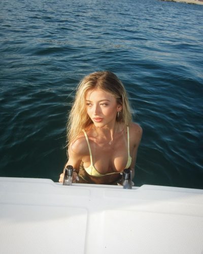 Emily Dobson wearing a soft fabric gown with intricate beading