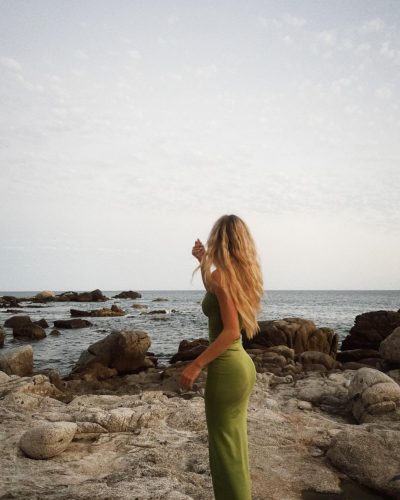 Emily Dobson wearing an elegant mermaid-style dress in soft hues