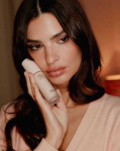 Emily Ratajkowski wearing floral dress and soft pink cardigan