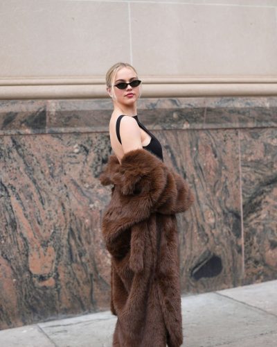 Emma Brooks black heels and vibrant yellow clutch