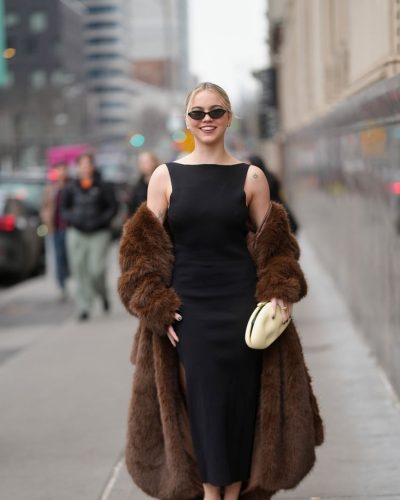 Emma Brooks stylish black dress with chic brown coat