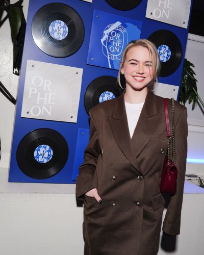 Emma Brooks fashionable brown suit with modern tailoring.