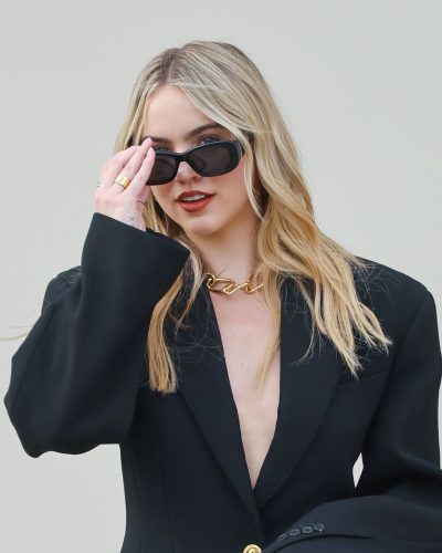 Emma Brooks structured black blazer accentuating her figure
