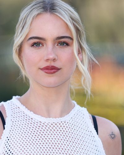 Emma Brooks chic black handbag complementing her outfit