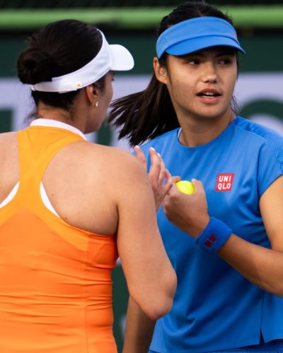 Emma Raducanu stylish blue dress paired with lightweight tennis shoes