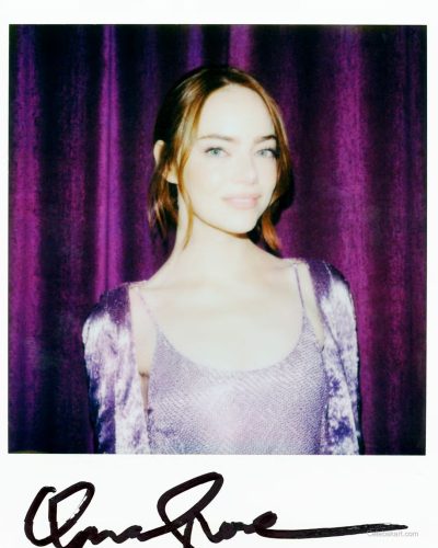 Emma Stone in a stylish purple gown with a modern twist